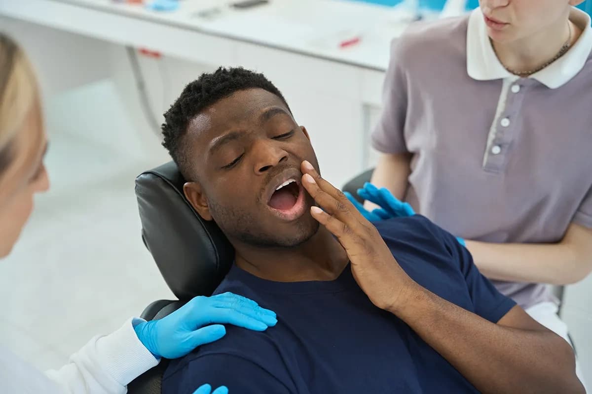 Friendly dentist reassuring a patient in a modern Ottawa dental clinic